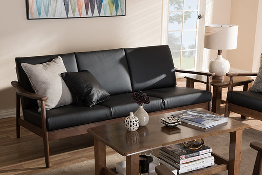 Baxton Studio Venza Mid-Century Modern Walnut Wood Black Faux Leather 3-Seater Sofa | Modishstore | Sofas